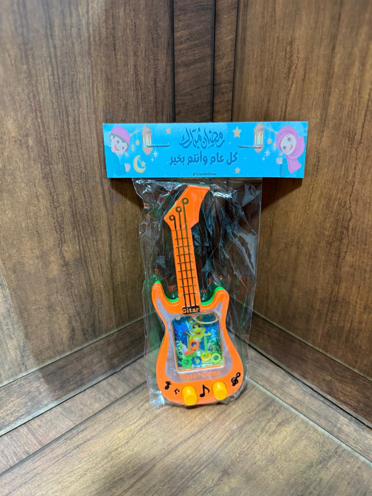 لعبة الجيتار مع تغليف لرمضان